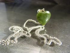 Jade heart shaped stone pendant on silver metal chain with small Albert