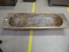 An Eastern European carved oblong trug.