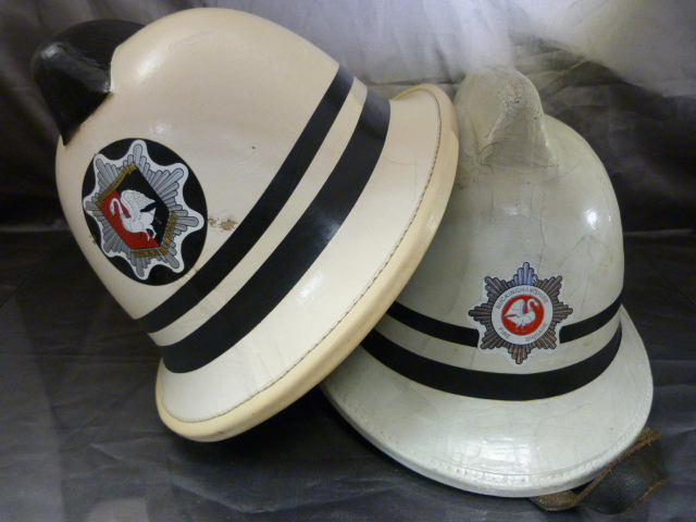 Pair of White Leather clad fire Brigade helmets