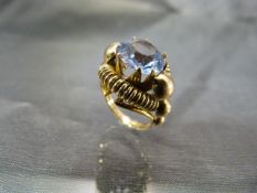 Gold faux Zircon ring, Centre Blue paste Zircon approx: 10mm diameter set into an American ‘Tank’