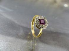 18ct Art Deco diamond and Ruby ring. The hexagonal platinum setting with central square cut bright