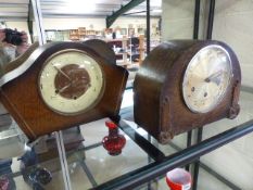 Two Art Deco oak veneered wooden chiming mantle clocks. One by Smiths