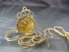 1909 Half Sovereign on a 9ct Gold mount and chain. Total approx weight - 8.6g