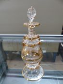 Pretty Late 19th Century gilded and clear glass scent bottle with original stopper still intact.