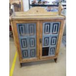 Leaded glass fronted light oak cabinet with beaded decoration around the frieze. (missing one