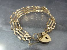 9ct Rose Gold 4 bar gate bracelet with padlock heart and safety chain. Total approx weight - 9.2g