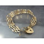 9ct Rose Gold 4 bar gate bracelet with padlock heart and safety chain. Total approx weight - 9.2g