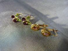 2 Pairs of Gold Gem set earrings (1) 18ct (750) set with oval pink stone. (2) 9ct (375) stylised