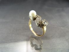 Victorian Gold (unmarked) Diamond and Pearl Ring, set with an approx: 0.50pt Old Mine cut Diamond