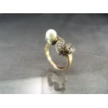 Victorian Gold (unmarked) Diamond and Pearl Ring, set with an approx: 0.50pt Old Mine cut Diamond