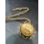 1914 Half Sovereign in 9ct mount and with 9ct Chain. Total weight 9.3g