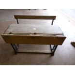 Wrought iron framed early double school desk. Lift top and seats.