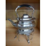 Silverplated Teapot and trivet with oil burner below. Ebony Handle and lid. Two keys attach the