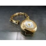 Ladies Fob watch with 14ct case and 9ct strap (A/F)