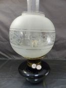 Oil lamp by J Wippell & Co Exeter with chimney and shade