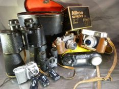 Leather cased Telstar binoculars 20x65, pair of Tasco binocular, Nikon Sprint, Halina Camera, and