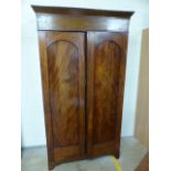 William and Mary two door flamed mahogany wardrobe with planked back. (Back leg A/F)