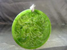 Chinese Jade circular pendant (approx 5.5cm diam) carved to both sides. One side with the dragon