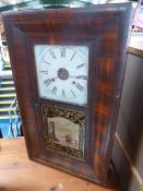 American Dollar clock in rectangular wooden case manufactured by Jerome and co, complete with