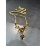 9ct Gold (1989) Garnet necklace on a 20" POW chain marked 9ct. The pendant finished in a heart
