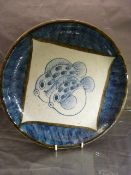 Earthenware oriental shallow bowl with central puffer fish decoration and rectangular blue mark to