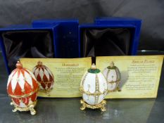 Two Atlas Edition Faberge style decorative eggs