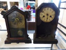 Antique wooden German mantle clock of small form. In need of repair, along with one other. Labels to