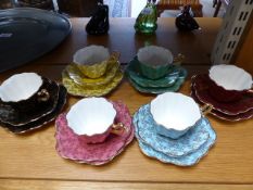 A Royal Stuart multi coloured six part tea service with gilt decoration by Spencer Stevenson