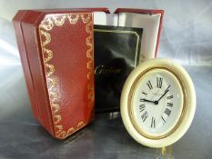 CARTIER - Desk Clock by Cartier Paris with 8 day movement. The outer frame in a Creme enamel and