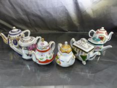 Seven miniature Teapots by Porcelain Arts. Some with tags