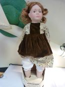 Alresford 1979 bisque headed chinal doll with mouse brown hair and corduroy clothing. In original