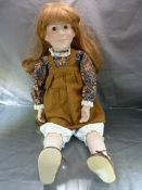 Alresford Bisque headed doll with blonde hair and patterned dress. Soft bodied with bisque arms