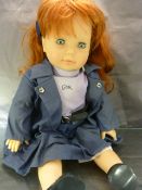 Gotz Doll marked on clothes. Vinyl body with red hair.