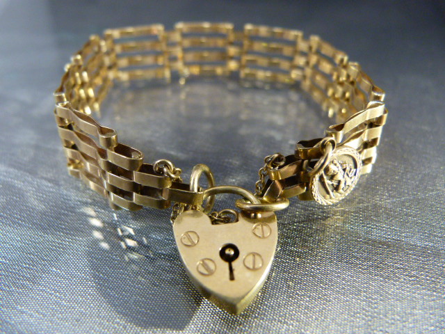 9ct Gold Gate Bracelet with mount 9ct St Christopher. Safety chain and lock in working order.