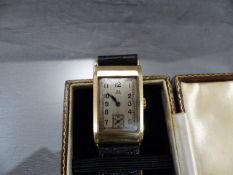 Omega: Vintage gents Omega watch on 9ct gold the square dial with subsidiary second hand on a