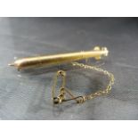 9ct Gold Hollow bar brooch in the form of a missile with safety chain attached - approx weight - 2.