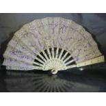Victorian openwork ivory and lacework fan. Inlaid with a white coloured metal and pierced