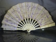 Victorian openwork ivory and lacework fan. Inlaid with a white coloured metal and pierced