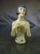 Tea cosy embellishment of a nude lady with bobbed hair (porcelain) c.1920's