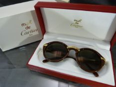 MUST DE CARTIER PARIS - Pair of 1980's Cartier sunglasses in original fitted case. The Circular