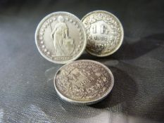 Coins - 1 Swiss Franc 1931, 1 Swiss Franc 1931 and 1 Swiss Franc 1944.