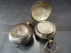 Sovereign holders - 1 of silver coloured metal and not marked, the other plated.