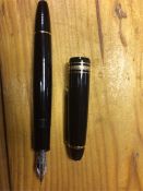 A Mont Blanc "Meisterstuck" black fountain pen with two tone nib (marked 14k) and Mont Blanc star to