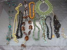 Small collection of costume jewellery to include natural stone bracelet, faux amber beads etc