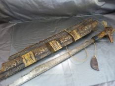 Borneo Dayak Parang. The scabbard carved with a dragon stretching the whole length which also houses