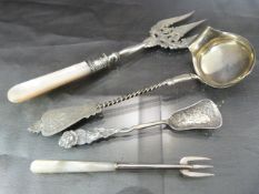 Four unusual silver items - Silver Coloured ladle marked L.V. 13 1/2. Monogrammed E.S with Barley