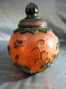 Chinese Peking Glass vase and cover of bulbous form. The Red body decorated with green overlay in