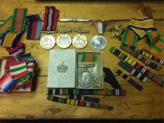 A collection of militaria to include five unmarked medals, ribbons, bars stars, RAF pin etc