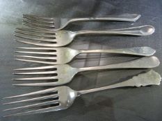 Five hallmarked silver dessert forks, to include assay offices Sheffield, Birmingham and London.