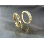 Two 9ct Eternity type rings. One set with half band of sapphires and the other set with Diamonds.